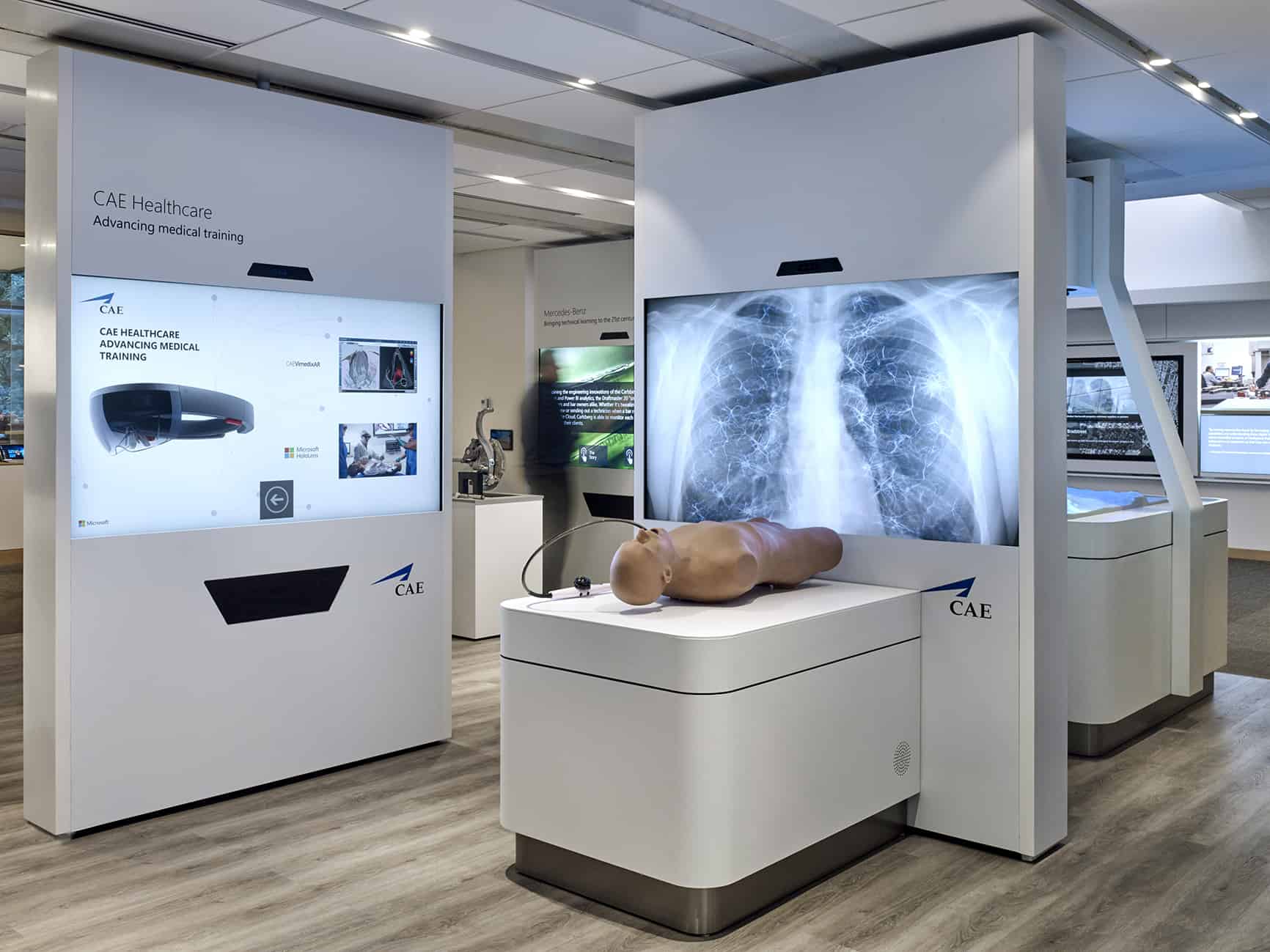 A modern healthcare simulation setup with a medical mannequin, X-ray displays, and advanced educational equipment.
